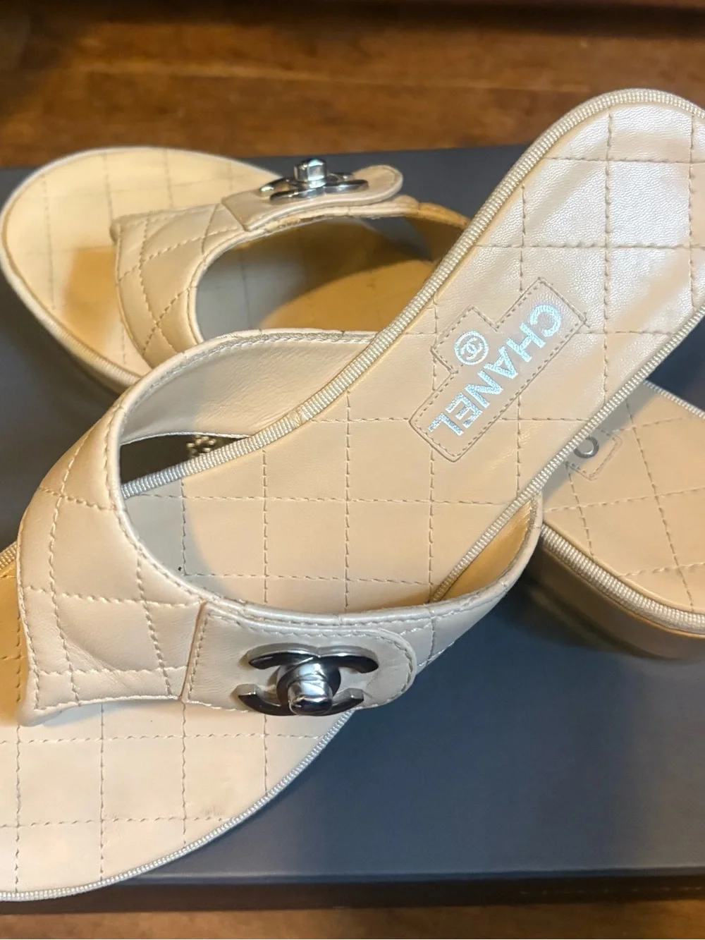 CHANEL Quilted Leather Thong Mules in Cream with Silver CC Logo